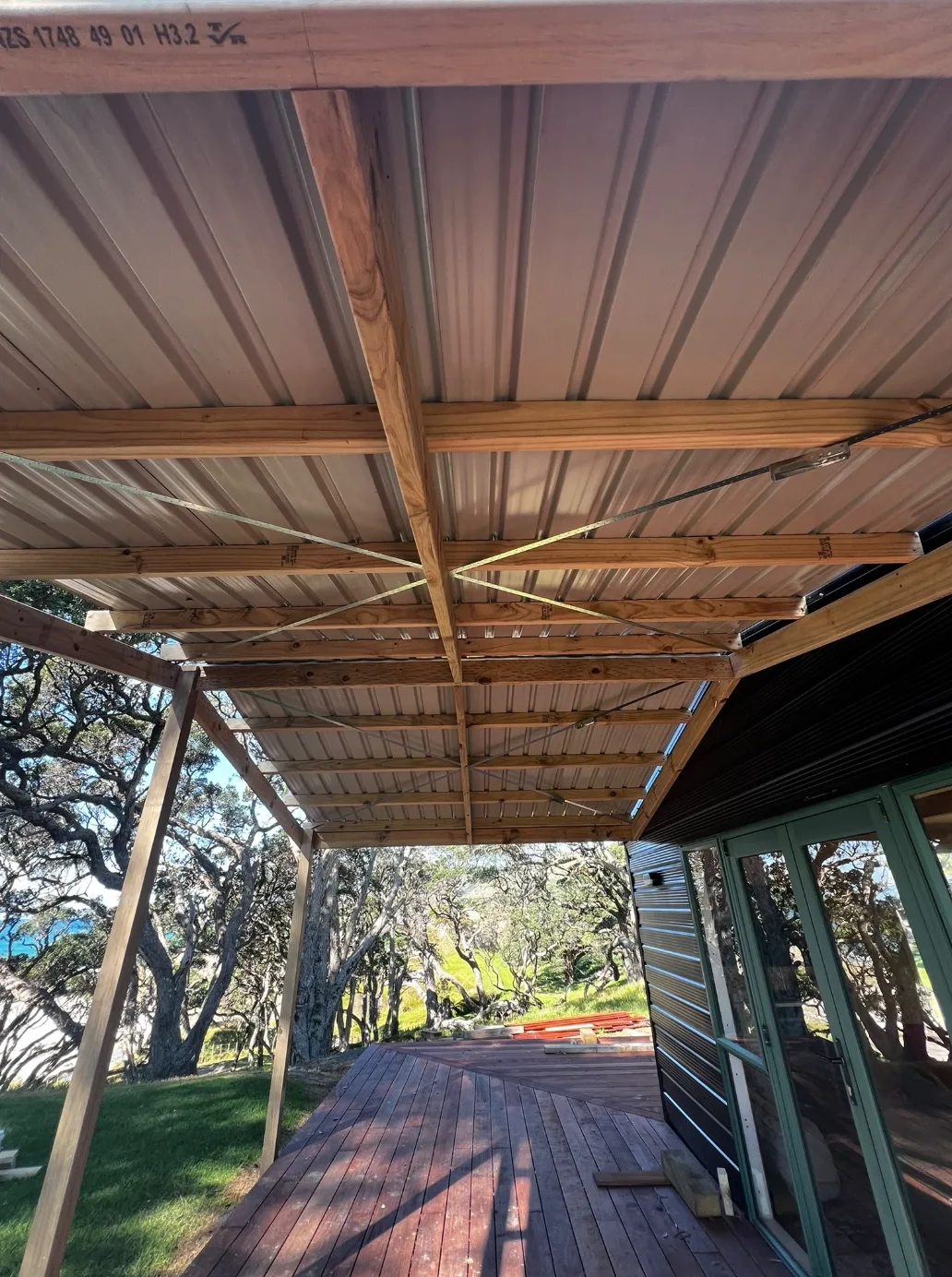 Timber-framed covered outdoor area with long-run steel roofing